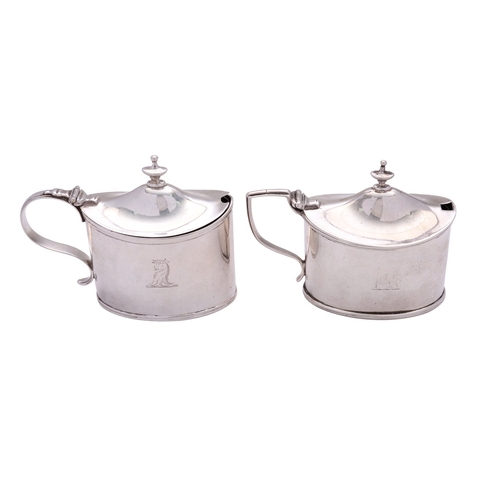 45 - Two similar George III silver mustard pots by William Abdy II, London 1801 and 1810, each oval strai... 