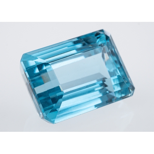 483 - A Brazilian blue topaz of good colour, the step cut rectangular stone of around 23 carats.