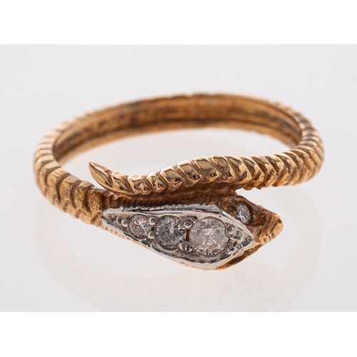 504 - A gold  ring in the form of a serpent the head set with diamonds, 18ct, ring size O