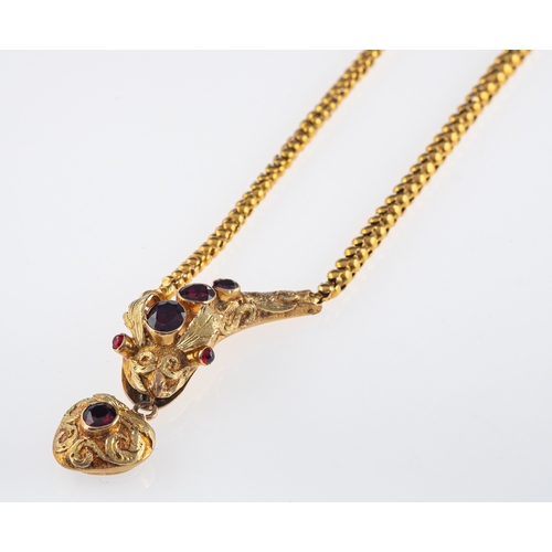 507 - A Victorian gold serpent  necklace. the head and heart locket set with garnets,heart with locket bac... 