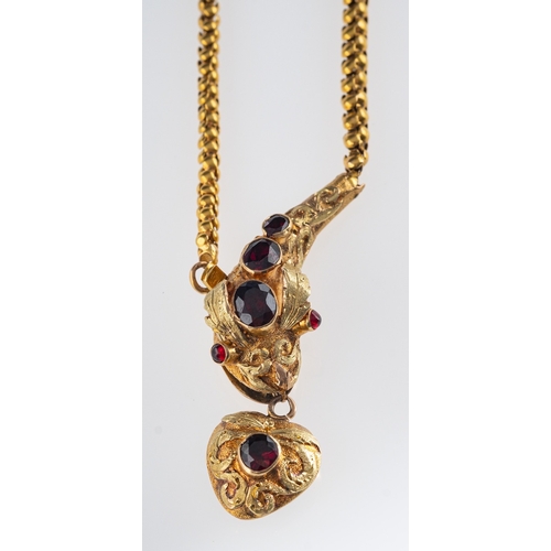 507 - A Victorian gold serpent  necklace. the head and heart locket set with garnets,heart with locket bac... 