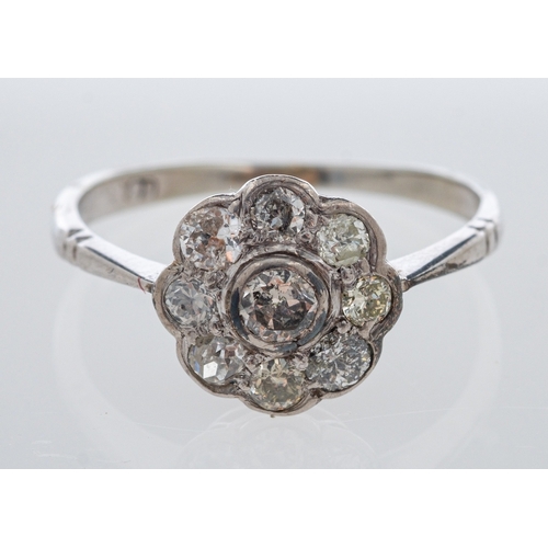 513 - A diamond daisy setting ring, in white gold, estimated total diamond weight, 0.50 carat