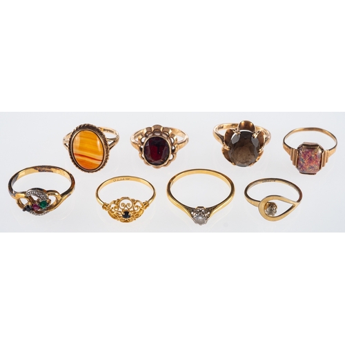 518 - A garnet dress ring, an agate ring and six others.