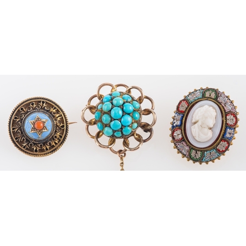 529 - Three brooches, including a cabochon-cut turquoise brooch, with scalloped surround; an Etruscan Revi... 