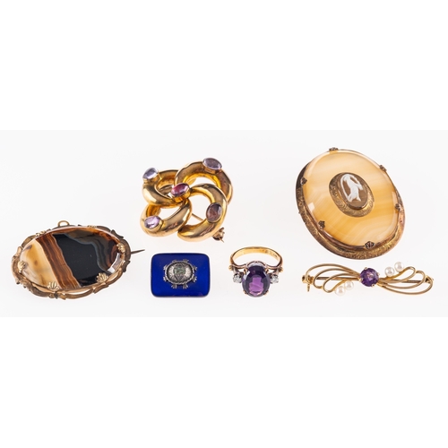 530 - Five brooches, to include;-  two agate set oval brooches; a blue enamel brooch; an amethyst and cult... 