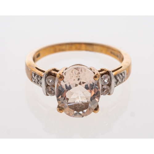 541 - A pale peach coloured  morganite ring with white sapphire set shoulders. 9ct gold ring size N