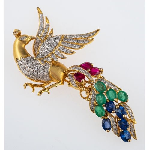 551 - A multi gem set peacock brooch, satin finish gold the body pave set with diamonds, the tail set with... 