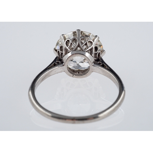 564 - A solitaire diamond ring, the transitional cut stone of around 3.12 carat in a platinum crown with h... 