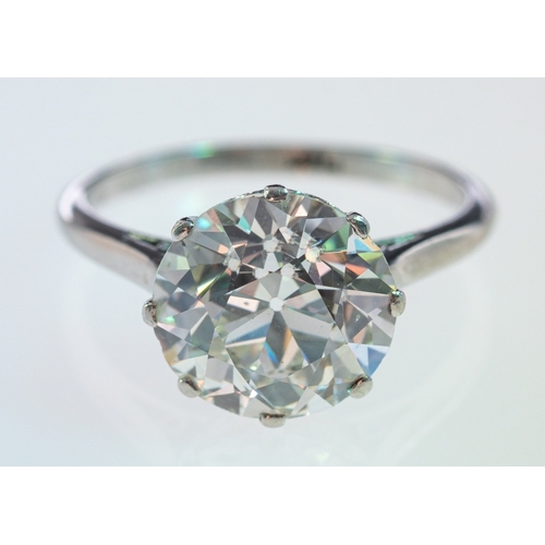 564 - A solitaire diamond ring, the transitional cut stone of around 3.12 carat in a platinum crown with h... 