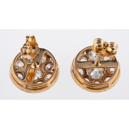 566 - An  Edwardian diamond set earrings, set with old cut stones in a millgrain setting, the principle di... 