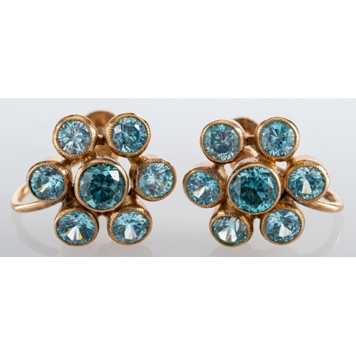 577 - A pair of 1940'S natural blue zircon cluster earrings; each flowerhead cluster collet set with brill... 