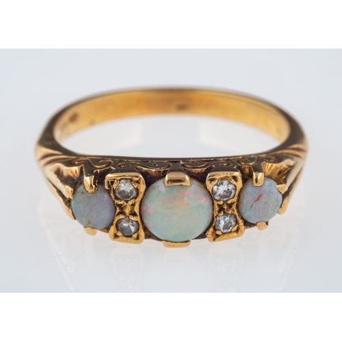 596 - An opal and diamond ring, the three circular cabochon opals with eight cut diamonds in between, ring... 