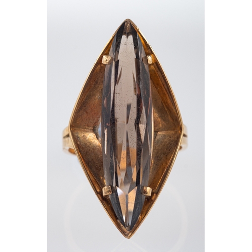 610 - A 1970's dress ring of angular form set with a smoky quartz, ring head size, 3.2cm ring size M-N gro... 