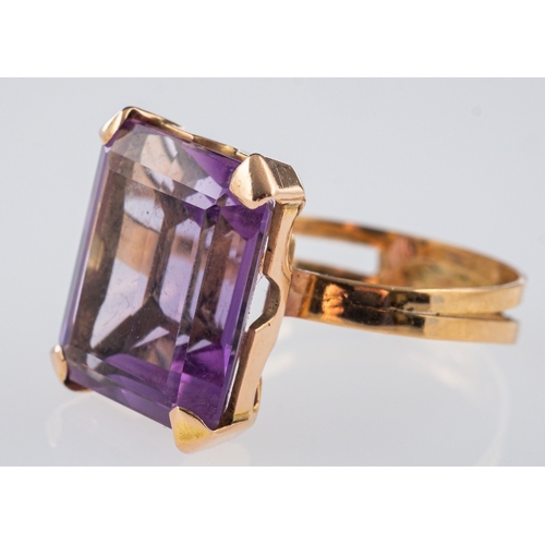 613 - A vintage cocktail ring set with a large amethyst in hand crafted gold mount, unmarked believed to b... 