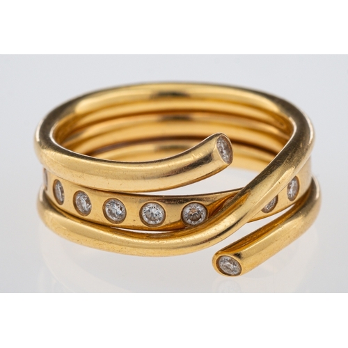 617 - George Jensen a Magic ring combination of a gold band inset with brilliant cut diamonds and a crosso... 