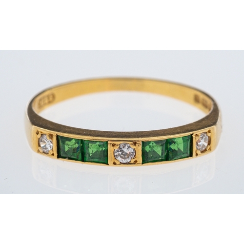 622 - An emerald & diamond ring set with square cut emeralds and brilliant cut diamonds, in 18ct gold, rin... 