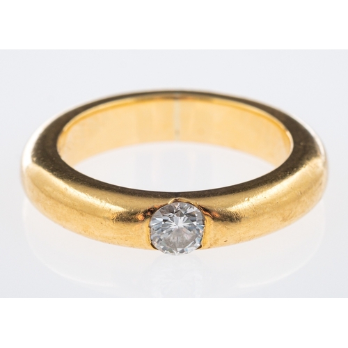 623 - A heavy gold band ring single stone diamond ring inset with a diamond of 0.25 carats, 18ct gold