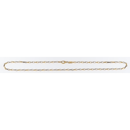 666 - A white & yellow gold chain necklace of twisted loop links, marks for 18ct gold, length 46cm