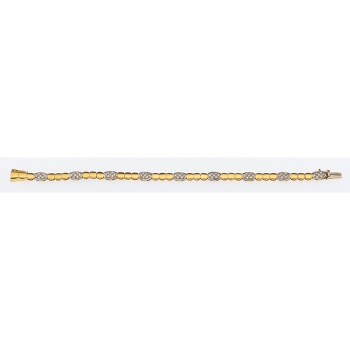 674 - A bracelet of articulated links in 18ct yellow gold interspersed with diamond set plaques in white g... 