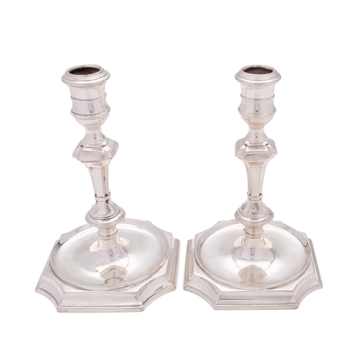 76 - A pair of Scottish cast silver candlesticks, maker's mark RIX (not traced), Edinburgh 2004, with ree... 