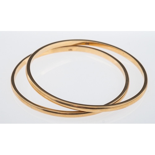 824 - Two plain bangles, marks for 9ct gold, internal measurement 6cm, weight 27.9 grams