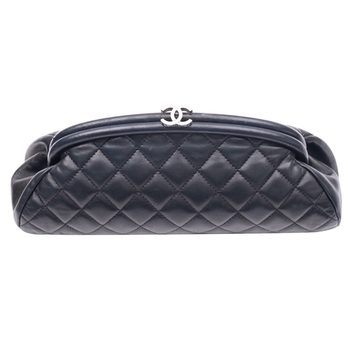 848 - Chanel. A black quilted Timeless Clutch bag, with silver tone hardware, 2006-2008,  interior hologra... 