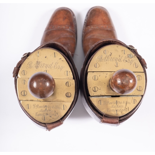 125 - A pair of gentleman's tan leather riding boots and brass mounted wooden trees by G. Dewberry, makers... 