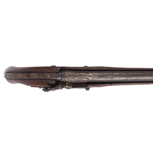 181 - A continental percussion cap pistol. the 12 inch barrel with gilt inlay over matching exaggerated ta... 