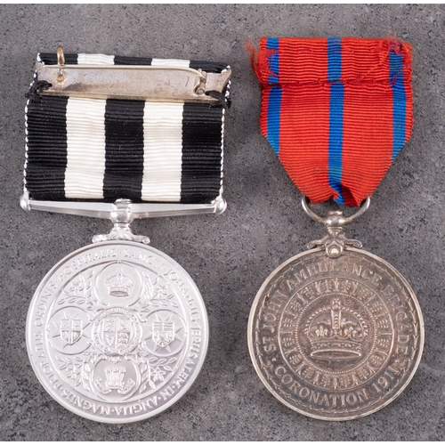 306 - A George V St John Ambulance Brigade Coronation Medal 1911, 'Pte A. Mackman', together with Service ... 