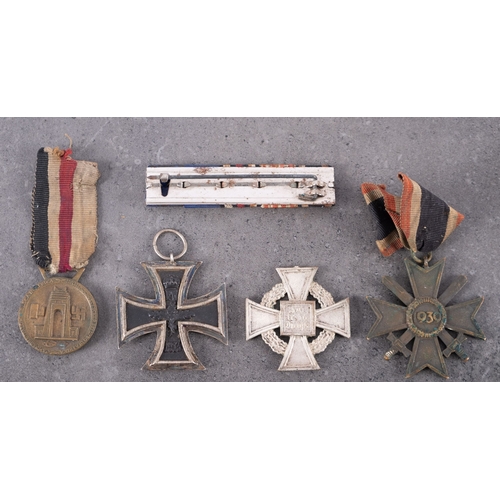 315 - A WWI Iron Cross, second class, together with a WWII German/Italian North Africa Medal, a Faithful S... 