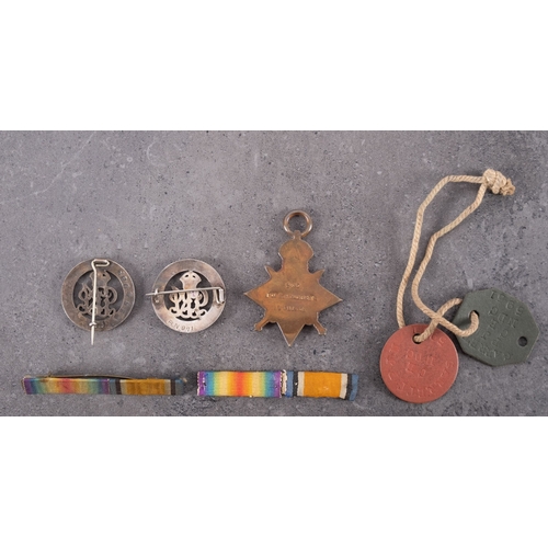 319 - A 1914-15 Star,'2403 Pte W.H. Harrison L'Pool R', together with two silver War Badges, 'RN971' and '... 