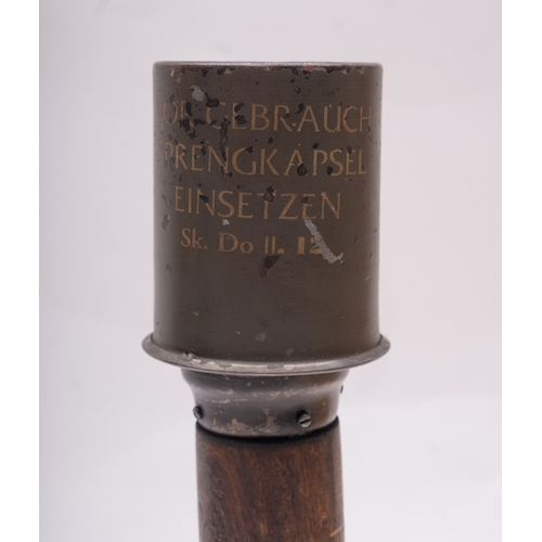 324 - A WWII German stick grenade, dated 1939 and stamped 'RR564' and also 'Wa A 564', 34cm long