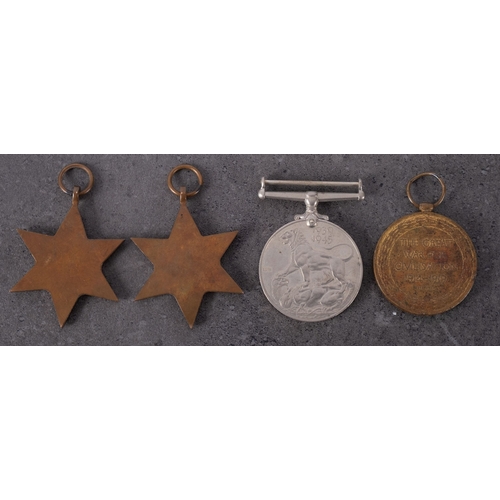 359 - A WWI Victory Medal to DM2-189988 Pte J  W Foulston ASC' together with a WWII group of three in card... 