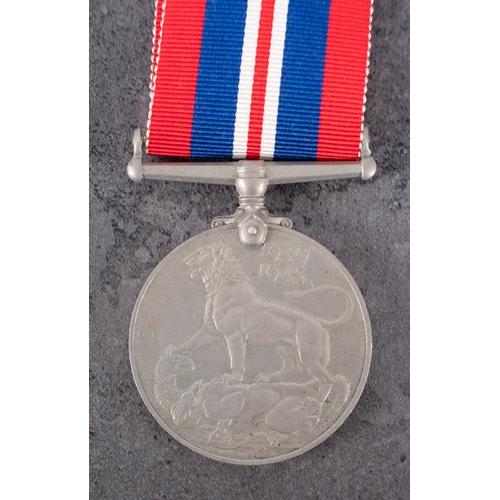 373 - A WWII War Medal  together with Soldier's Service Pay Book and Release Books for  '14947532 Pte J Wh... 