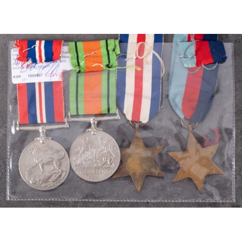 376 - A WWII group of four comprising 1939-45 Star, France & Germany Star, War Medal and Defense Medal, to... 