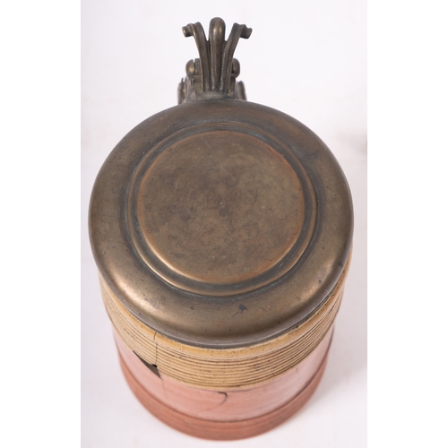 95 - An 18th century lidded pottery tankard, the cover dated 1742, over a ribbed body, with reputed muske... 