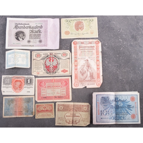 839 - WITHDRAWN LOT   A collection of world bank notes, including sequential 1908 German 100 notes (approx... 