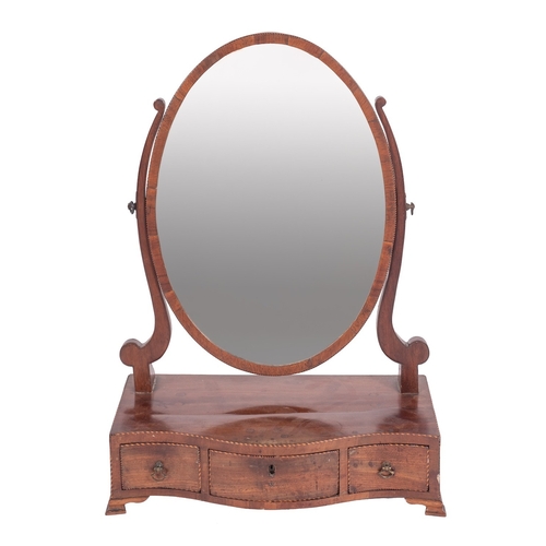 1001 - A George III mahogany and chequer strung dressing table mirror, late 18th century; the oval adjustab... 