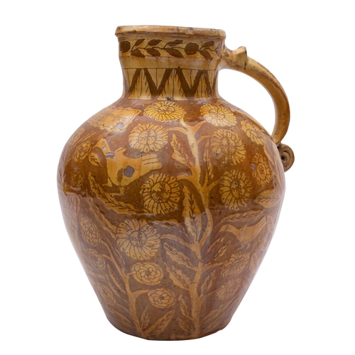 106 - A North Devon slipware harvest jug inscribed 'Mrs Hamlyn 1863', with pinched spout and loop handle w... 