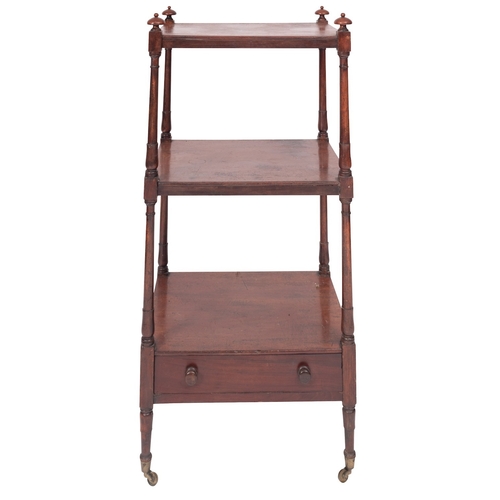 1069 - A Regency mahogany three tier etagere, early 19th century; with turned finials at the upper corners,... 