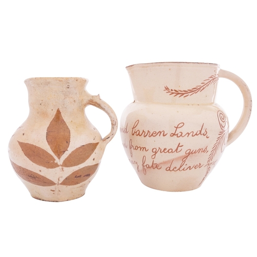 109 - A North Devon slipware jug by Alexander Lauder and one other the first sgraffito decorated with a ve... 