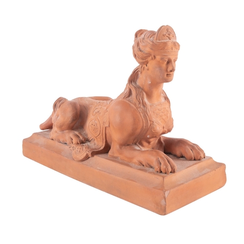 110 - A Watcombe [Torquay] pottery Sphinx, modelled on a rectangular base, impressed Watcombe Torquay at o... 