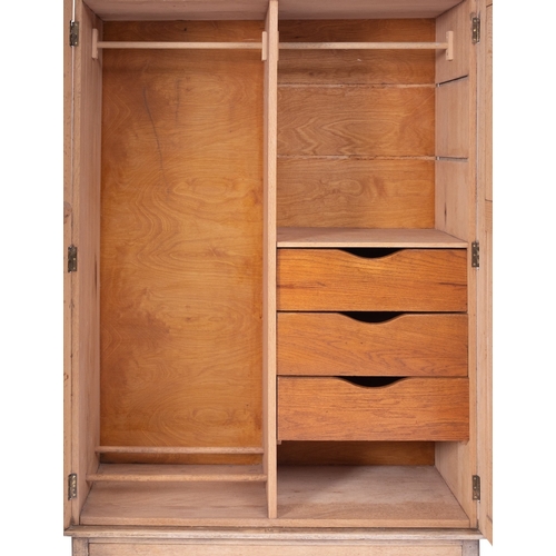 1174 - A bleached oak wardrobe in the manner of Heal & Son, early 20th century; the arched top of the twin ... 