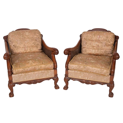 1178 - A carved mahogany and Damask silk upholstered bergère suite, circa 1925; comprising sofa and two arm... 