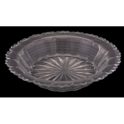 12 - A large early 19th century cut-glass bowl of stepped and fluted form with star-cut base, possibly Ir... 