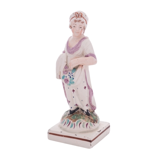 123 - A small Neale & Co. pearlware figure of a girl representing Spring on square base, circa 1790, 14cm ... 