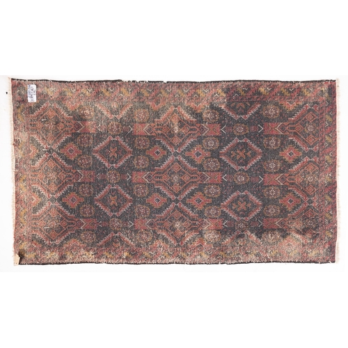 1265 - A Meshed rug, the shaded field with an all over design of serrated lozenge and flowerhead medallions... 