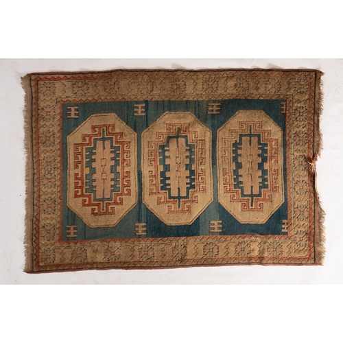 1268 - A Turkish rug, the pastel blue field with triple beige octagonal medallions and hooked geometric des... 