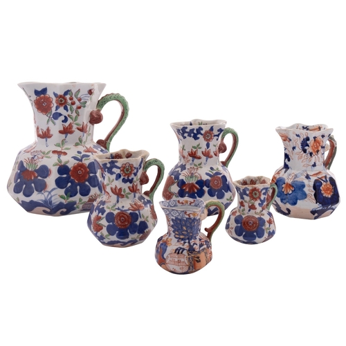 141 - A mixed lot comprising a graduated set of four reproduction Mason's-style Ironstone Hydra jugs, two ... 