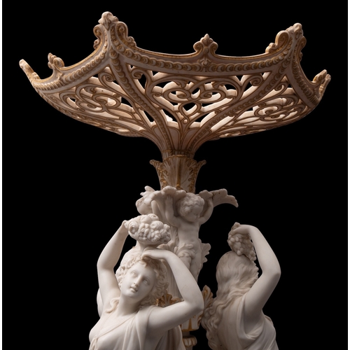 145 - A large 19th century Parian ware centrepiece heightened in gilt, the pierced bowl supported by three... 